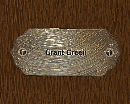 “MAMAS DON'T LET YOUR BABIES GROW UP TO BE COWBOYS”<br/>
Grant Green<br/>
2009 ongoing <br/>
C-Print of a Name Plate Reserving a Hotel Room in Perpetuity for the Guitar Jazz Legend, Grant Green<br/>
Mounted on Wood with Non-Glare Plexiglas Surface<br/>
7 3/4” x 9 3/4” x 3/4” <br/>