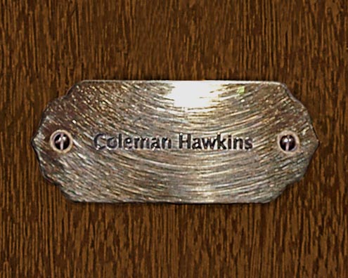 “MAMAS DON'T LET YOUR BABIES GROW UP TO BE COWBOYS”<br/>
Coleman Hawkins<br/>
2009 ongoing <br/>
C-Print of a Name Plate Reserving a Hotel Room in Perpetuity for the Tenor Sax Jazz Legend, Coleman Hawkins<br/>
Mounted on Wood with Non-Glare Plexiglas Surface<br/>
7 3/4” x 9 3/4” x 3/4” <br/>