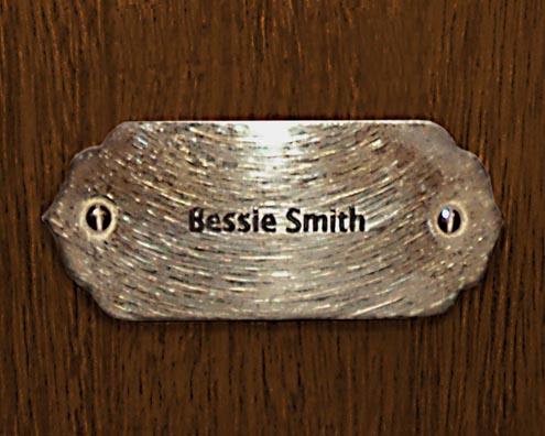 “MAMAS DON'T LET YOUR BABIES GROW UP TO BE COWBOYS”<br/>
Bessie Smith<br/>
2009 ongoing <br/>
C-Print of a Name Plate Reserving a Hotel Room in Perpetuity for the Songstress Jazz Legend, Bessie Smith<br/>
Mounted on Wood with Non-Glare Plexiglas Surface<br/>
7 3/4” x 9 3/4” x 3/4” <br/>