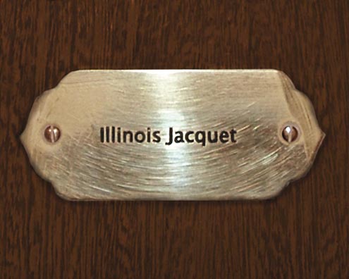 “MAMAS DON'T LET YOUR BABIES GROW UP TO BE COWBOYS”<br/>
Illinois Jacquet<br/>
2009 ongoing <br/>
C-Print of a Name Plate Reserving a Hotel Room in Perpetuity for the Multifarious Jazz Legend, Illinois Jacquet<br/>
Mounted on Wood with Non-Glare Plexiglas Surface<br/>
7 3/4” x 9 3/4” x 3/4” <br/>