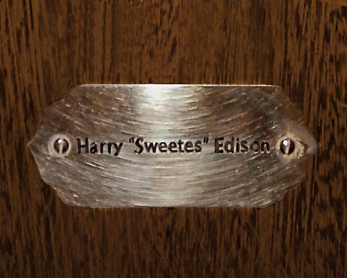 “MAMAS DON'T LET YOUR BABIES GROW UP TO BE COWBOYS”<br/>
Harry “Sweetes” Edison [Sic]<br/>
2009 ongoing <br/>
C-Print of a Name Plate Reserving a Hotel Room in Perpetuity for the Trumpet Jazz Legend, Harry Sweets Edison<br/>
Mounted on Wood with Non-Glare Plexiglas Surface<br/>
7 3/4” x 9 3/4” x 3/4” <br/>