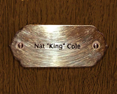 “MAMAS DON'T LET YOUR BABIES GROW UP TO BE COWBOYS”<br/>
Nat “King” Cole<br/>
2009 ongoing <br/>
C-Print of a Name Plate Reserving a Hotel Room in Perpetuity for the Songster/Piano Jazz Legend, Nat King Cole<br/>
Mounted on Wood with Non-Glare Plexiglas Surface<br/>
7 3/4” x 9 3/4” x 3/4” <br/>