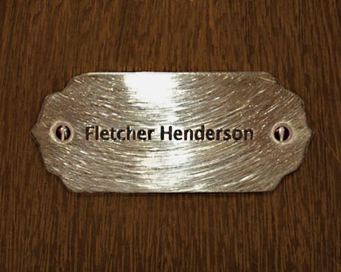 “MAMAS DON'T LET YOUR BABIES GROW UP TO BE COWBOYS”<br/>
Fletcher Henderson<br/>
2009 ongoing <br/>
C-Print of a Name Plate Reserving a Hotel Room in Perpetuity for the Piano Jazz Legend, Fletcher Henderson<br/>
Mounted on Wood with Non-Glare Plexiglas Surface<br/>
7 3/4” x 9 3/4” x 3/4” <br/>