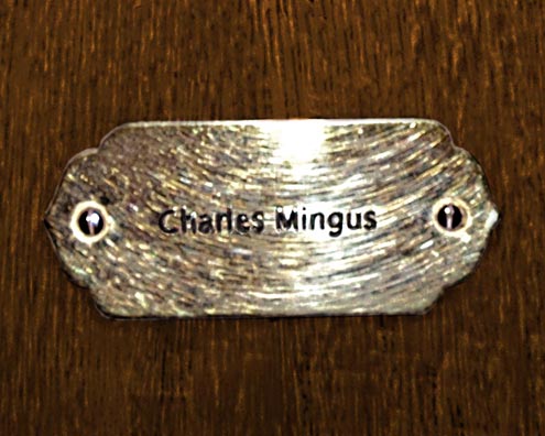 “MAMAS DON'T LET YOUR BABIES GROW UP TO BE COWBOYS”<br/>
Charles Mingus<br/>
2009 ongoing <br/>
C-Print of a Name Plate Reserving a Hotel Room in Perpetuity for the Multifarious Jazz Legend, Charles Mingus<br/>
Mounted on Wood with Non-Glare Plexiglas Surface<br/>
7 3/4” x 9 3/4” x 3/4” <br/>