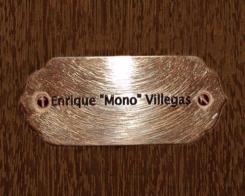 “MAMAS DON'T LET YOUR BABIES GROW UP TO BE COWBOYS”<br/>
Enrique “Mono” Villegas<br/>
2009 ongoing <br/>
C-Print of a Name Plate Reserving a Hotel Room in Perpetuity for the Piano Jazz Legend, Enrique “Mono” Villegas<br/>
Mounted on Wood with Non-Glare Plexiglas Surface<br/>
7 3/4” x 9 3/4” x 3/4” <br/>