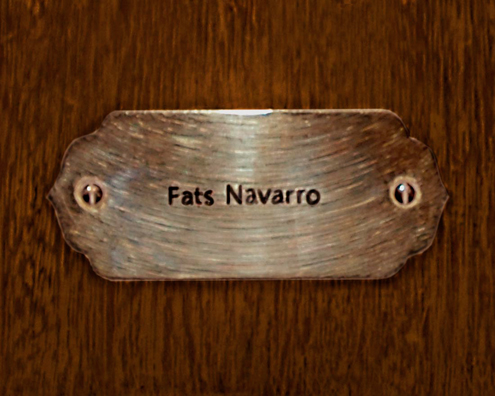 “MAMAS DON'T LET YOUR BABIES GROW UP TO BE COWBOYS”<br/>
Fats Navarro<br/>
2009 ongoing <br/>
C-Print of a Name Plate Reserving a Hotel Room in Perpetuity for the Tenor/Soprano Sax Jazz Legend, Fats Navarro<br/>
Mounted on Wood with Non-Glare Plexiglas Surface<br/>
7 3/4” x 9 3/4” x 3/4” <br/>