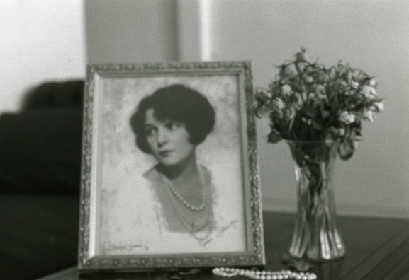 NORMA TALMADGE'S CHINESE THEATER: THE EUROPEAN LEG; KOLN<br />
1992 Ongoing<br />
Happening: Viewer's Immortalizing Themselves by Making Imprints in Fresh Cement in Homage to the Forgotten Silent Diva, Norma Talmadge, the Accidental Auteur of the Canonical Practice<br />
Photograph of Happening Displayed in Collector's Edition Photograph Book: Installation as Remembered by “By Right of Purchase” (1918), Devon Dikeou<br />
4” x 6”<br />