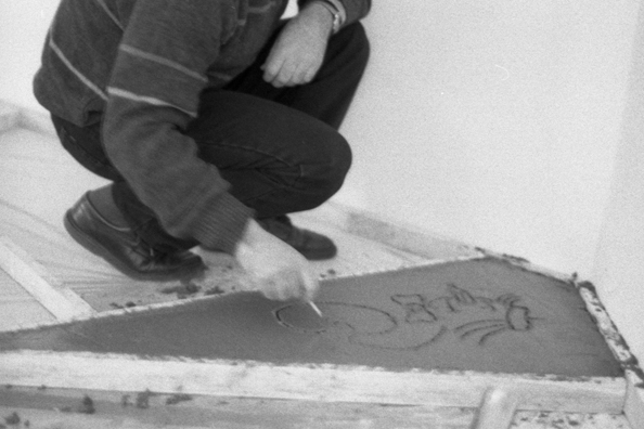 NORMA TALMADGE'S CHINESE THEATER: THE EUROPEAN LEG; KOLN<br />
1992 Ongoing<br />
Happening: Viewer's Immortalizing Themselves by Making Imprints in Fresh Cement in Homage to the Forgotten Silent Diva, Norma Talmadge, the Accidental Auteur of the Canonical Practice<br />
Photograph of Happening Displayed in Collector's Edition Photograph Book: “New York Nights” (1929)<br />
4” x 6”<br />