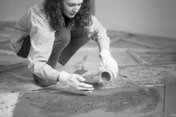 NORMA TALMADGE'S CHINESE THEATER: THE EUROPEAN LEG; KOLN<br />
1992 Ongoing<br />
Happening: Viewer's Immortalizing Themselves by Making Imprints in Fresh Cement in Homage to the Forgotten Silent Diva, Norma Talmadge, the Accidental Auteur of the Canonical Practice<br />
Photograph of Happening Displayed in Collector's Edition Photograph Book: Sabrina van der Ley, “De Luxe Annie” (1918)<br />
4” x 6”<br />