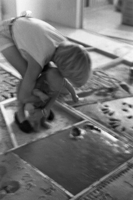 NORMA TALMADGE'S CHINESE THEATER: LA<br />
1992 Ongoing<br />
Happening: Viewers Immortalizing Themselves by Making Imprints in Fresh Cement in Homage to Forgotten Silent Diva, Norma Talmadge, the Accidental Auteur of the Canonical Practice<br />
Photograph of Happening Displayed in Collector's Edition Photograph Book: Natalie and Nicholas Fair, “Smilin' Through” (1922)<br />
4” x 6”<br />