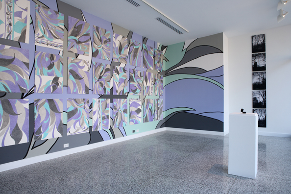 MARILYN MONROE WANTED TO BE BURIED IN PUCCI <br />
2008 Ongoing <br />
White Wall: 5 (DiMaggio's Yankee Number) Black & White Cibachromes of the Flag at Half Mast the Day Joe DiMaggio Died <br />
Mounted in Aluminum with Non-Glare Plexiglas, Installed Vertically<br/>
15” x 23” Each<br />
Patterned Walls: 36 (The Age of Monroe when She Died) Watercolors of a Pucci Dress Installed on a Wall Mural of the Same Pattern<br />
24” x 36” Each<br />
Podium: Replica of the Eternity Ring Given by DiMaggio to Monroe on the Occasion of their Marriage<br />
Provided by Tiffany & Co and Left for Viewers to Try on<br /> 
Variable Dimensions<br />
Unique<br />