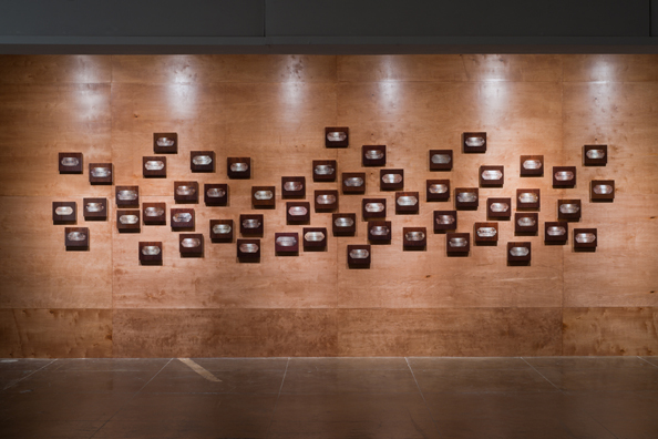 “MAMAS DON'T LET YOUR BABIES GROW UP TO BE COWBOYS”<br/>
2009 ongoing <br/>
Wall: 56 C-Prints of Name Plates Reserving Hotel Rooms in Perpetuity for 56 Jazz Legends Mounted on Wood with Non-Glare Plexiglas Surface and Installed on a Wall of Wood Paneling<br/>
C-Prints: 7 3/4” x 9 3/4” x 3/4” Each<br/>