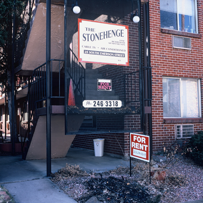 DISPLACED DENVER: THE STONEHENGE<br/>
2000 Ongoing <br/>
Cibachrome Print <br/>
Series of Denver Apartment Buildings Named After Famous Politicians, Artists, Landmarks, Neighborhoods, Beaches, Styles, Museums, Islands, Cocktails, Clothing, Pirates, Warriors, Automobiles, Restaurants, Race Tracks, Festivals, Writers, Cities, Explorers, Teams, Palaces, Stores, Poets, Song Writers, Hotels, Magazines, Fictional Places, Architectural Elements, Holidays, Etc <br/ >