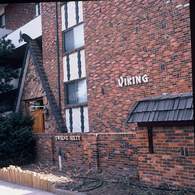 DISPLACED DENVER: THE VIKING<br/>
2000 Ongoing <br/>
Cibachrome Print <br/>
Series of Denver Apartment Buildings Named After Famous Politicians, Artists, Landmarks, Neighborhoods, Beaches, Styles, Museums, Islands, Cocktails, Clothing, Pirates, Warriors, Automobiles, Restaurants, Race Tracks, Festivals, Writers, Cities, Explorers, Teams, Palaces, Stores, Poets, Song Writers, Hotels, Magazines, Fictional Places, Architectural Elements, Holidays, Etc <br/ >