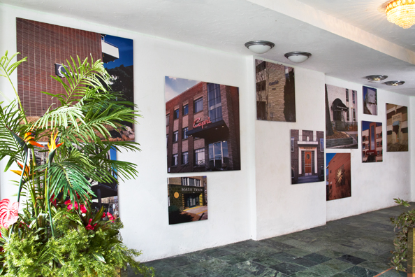 “IT’S DÉJÀ VU ALL OVER AGAIN” – YOGI BERRA <br/>
Floor: Cajole: Tropical Paradise<br/>
1992 Ongoing <br/>
Artificial Flowers and Plants, Plant Identification Sign, Mirrored Planter <br/>
Replicating Mall Ambiance <br/>
3’x3’x8’ Each<br/>
Unique, 2 AP<br/>
Walls: Displaced Denver<br/>
2000 Ongoing<br/>
Cibachrome Prints<br/>
Series of Denver Apartment Buildings Named After Famous Politicians, Artists, Landmarks, Neighborhoods, Beaches, Styles, Museums, Islands, Cocktails, Clothing, Pirates, Warriors, Automobiles, Restaurants, Race Tracks, Festivals, Writers, Cities, Explorers, Teams, Palaces, Stores, Poets, Song Writers, Hotels, Magazines, Fictional Places, Architectural Elements, Holidays, Etc<br/>
Edition: 3, 1 AP<br/>